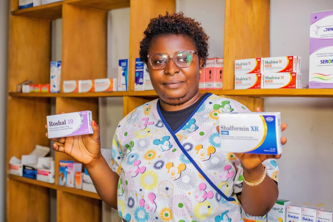 Pharmacist holding medication in the clinic pharmacy